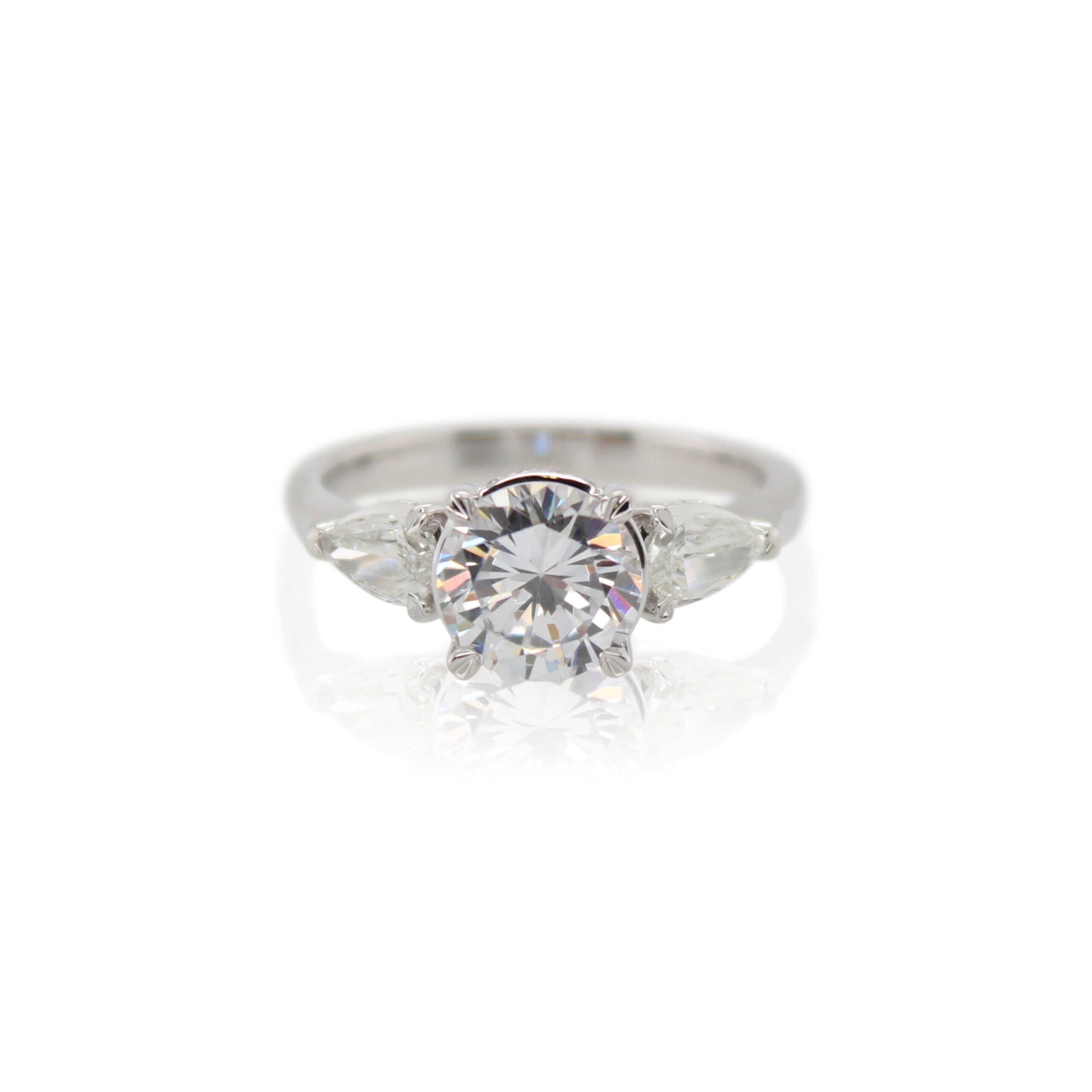 Crisscut New York Diamond Pear Accent Engagement Ring