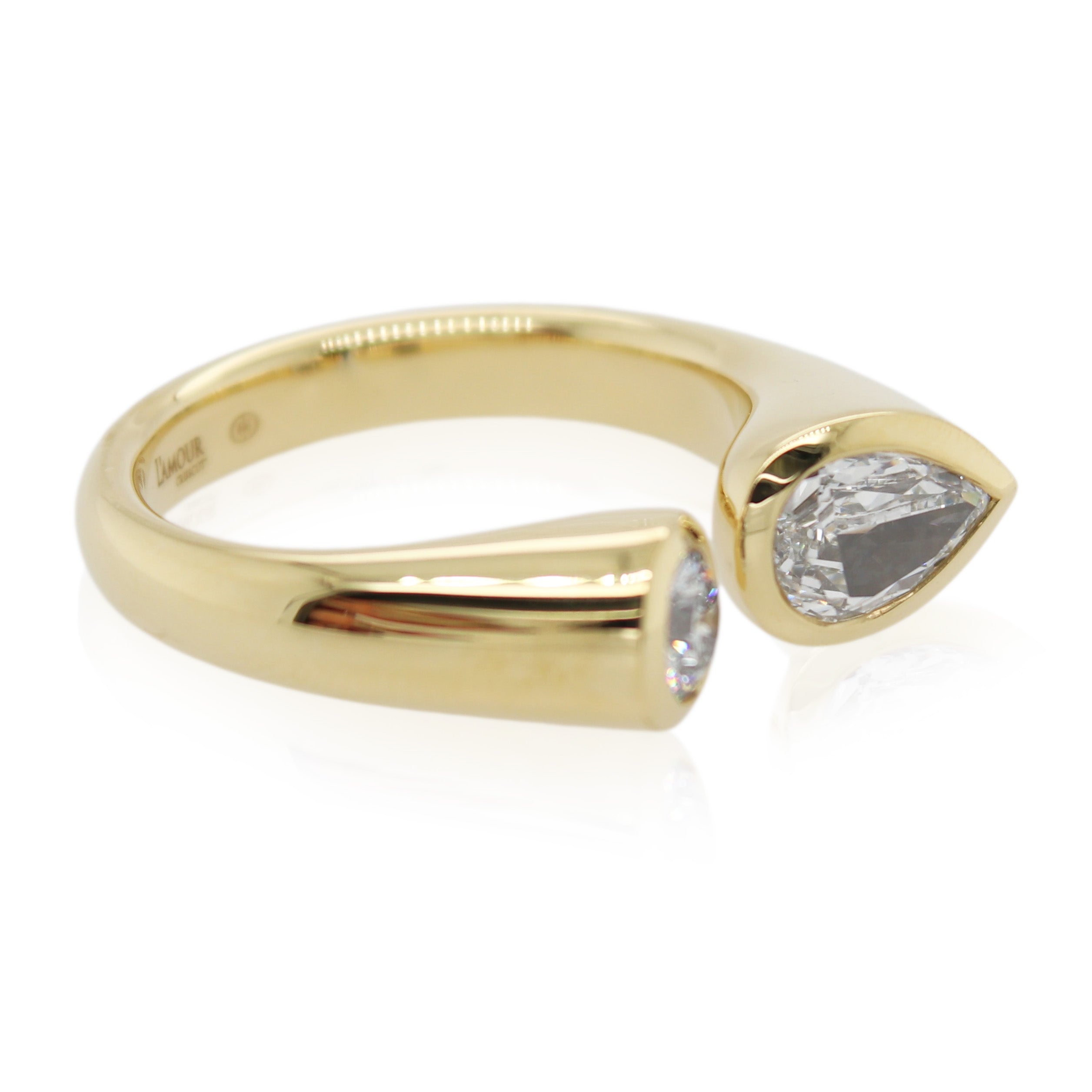 Pear Shaped and Round Diamond Ring