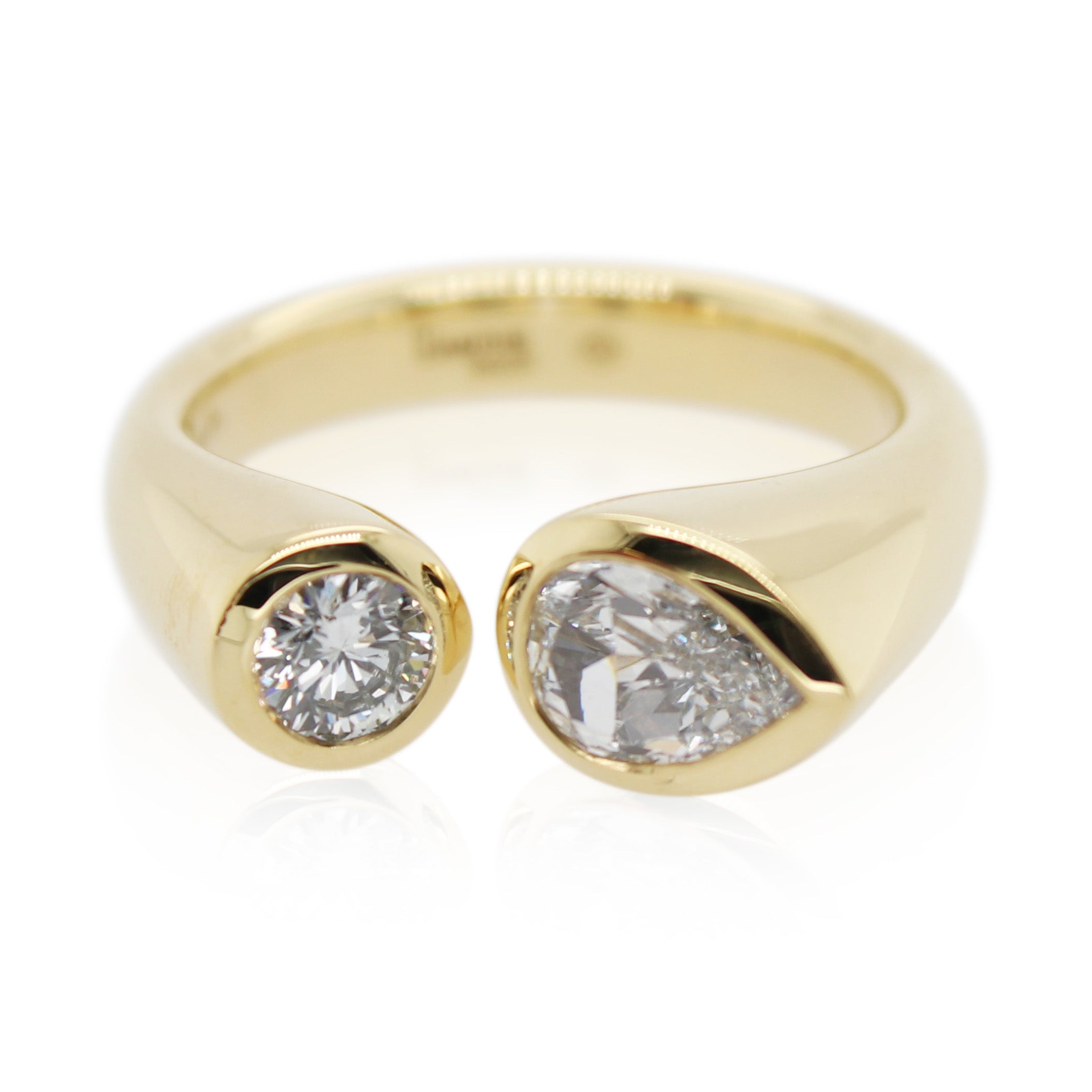 Pear Shaped and Round Diamond Ring