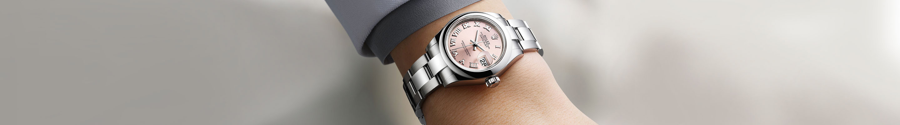 Silver Rolex Watch on a Professional Woman's Wrist