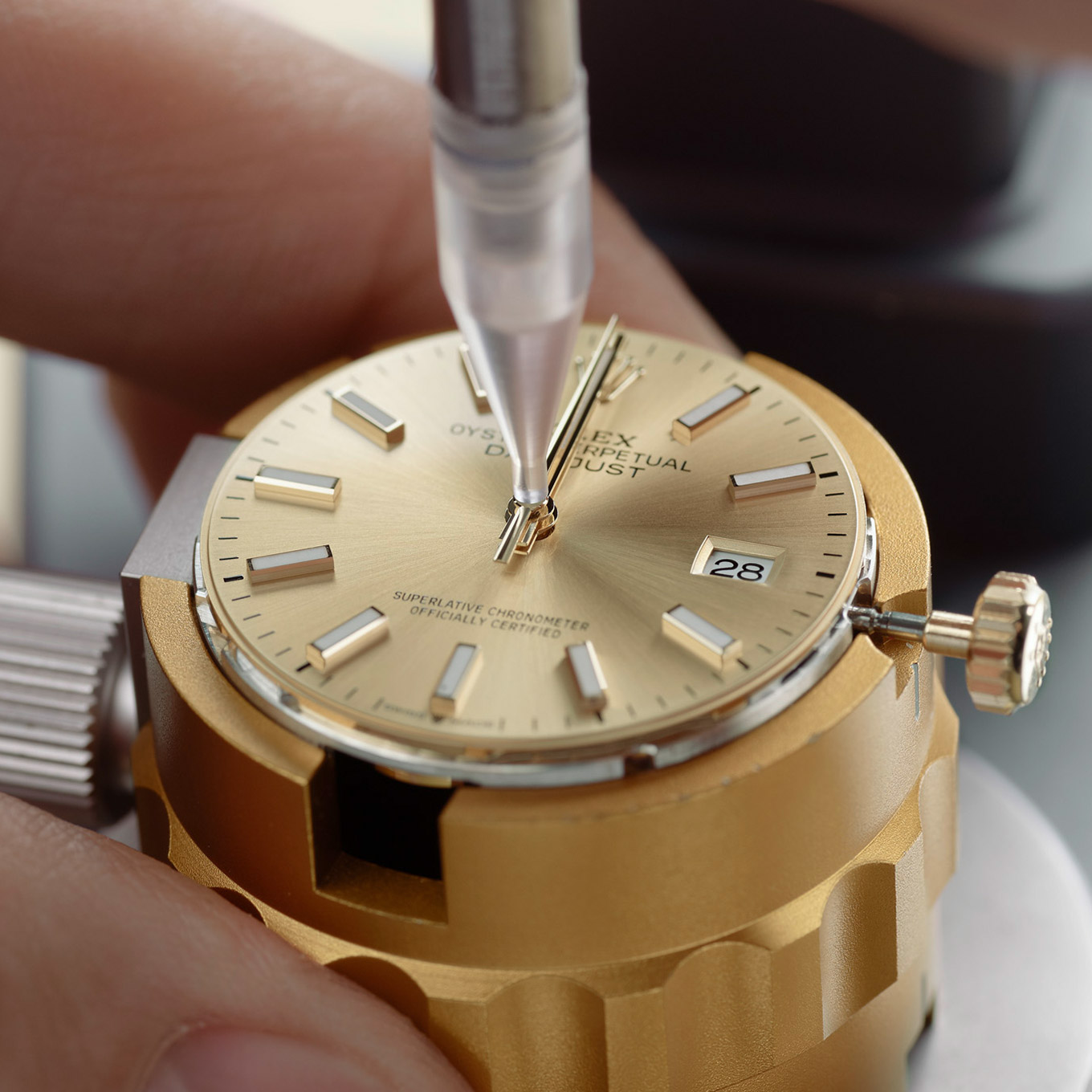 rolex watch being reassembeled