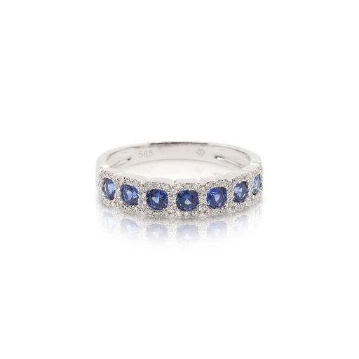 This sapphire and diamond ring by Rafael is crafted from 14k white gold and features 0.56 total carats of blue sapphires and 0.18 total carats of diamonds around the halos.