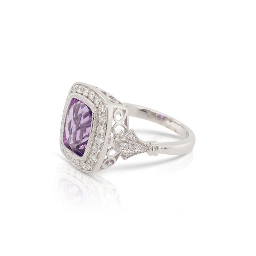 This amethyst and diamond ring by Rafael is crafted from 14k white gold and features a 3.00 carat cushion shaped amethyst and 0.35 total carats of diamonds around the halo.
