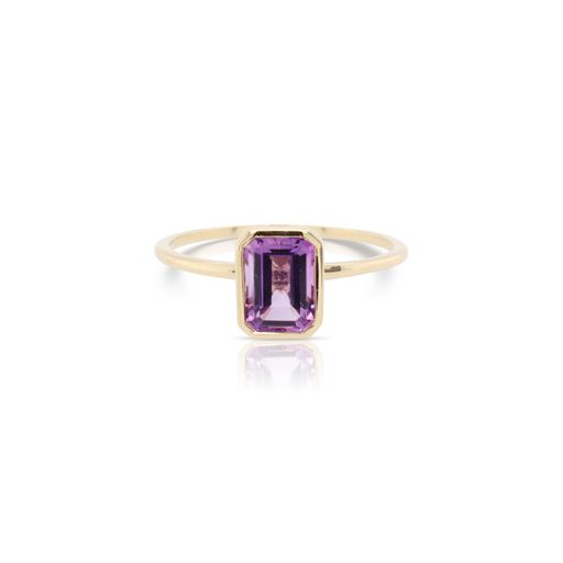 This solitaire amethyst ring by Rafael is crafted from 14k yellow gold and features a 1.00 carat emerald cut amethyst.