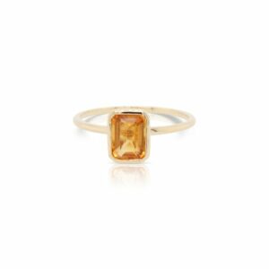 This solitaire citrine ring by Rafael is crafted from 14k yellow gold and features a 1.00 carat emerald cut citrine.