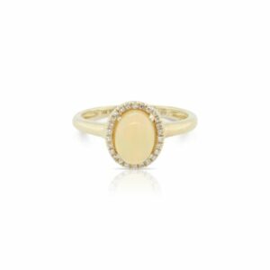 This opal and diamond ring by Rafael is crafted from 14k yellow gold and features a 0.85 carat oval opal and 0.06 total carats of diamonds around the halo.