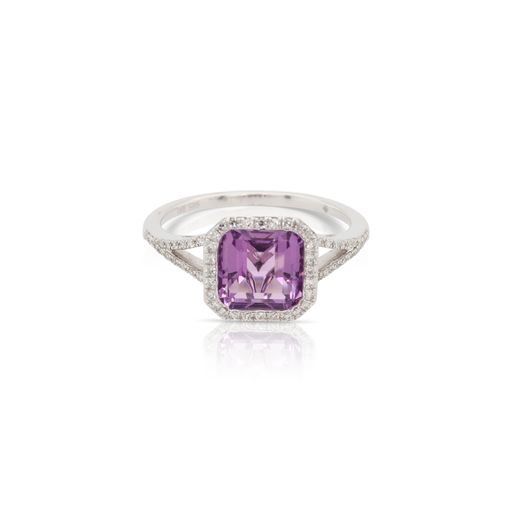 This amethyst and diamond ring by Rafael is crafted from 14k white gold and features a 1.50 carat cushion shaped amethyst and 0.14 total carats of diamonds along the sides and halo.