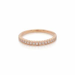 This diamond ring from Forevermark Tribute™ Collection is crafted from 18k rose gold and features 0.20 total carats of half bezel set diamonds.