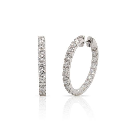 This pair of diamond hoop earrings from Forevermark Tribute™ Collection is crafted from 18k white gold and features 3.00 total carats of diamonds.