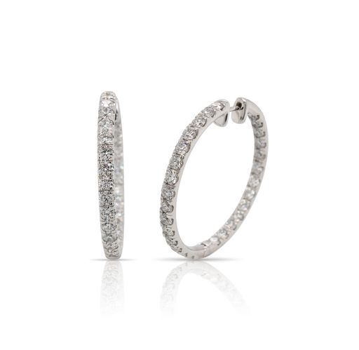 This pair of diamond hoop earrings from Forevermark Tribute™ Collection is crafted from 14k white gold and features 5.00 total carats of diamonds.