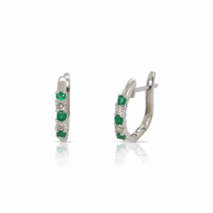 This pair of emerald and diamond hoop earrings by Rafael is crafted from 14k white gold and features 0.30 total carats of emeralds and 0.15 total carats of diamonds.