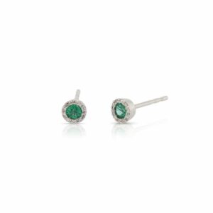 This pair of emerald and diamond earrings by Rafael is crafted from 14k white gold and features 0.24 total carats of round emeralds and 0.07 total carats of diamonds around the halo.