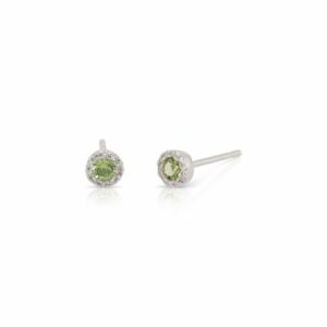 This pair of peridot and diamond earrings by Rafael is crafted from 14k white gold and features 0.26 total carats of round peridot and 0.07 total carats of diamonds around the halo.