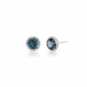 This pair of London blue topaz and diamond earrings by Rafael is crafted from 14k white gold and features 2.25 total carats of round London blue topaz and 0.08 total carats of diamonds around the halo.