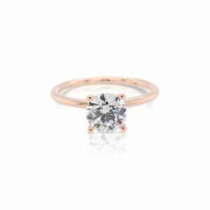 This diamond engagement ring mounting by Sylvie is crafted from 14k rose gold and is for a 1.25 carat diamond. The center diamond is chosen separately.