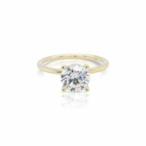 This diamond engagement ring mounting by Sylvie is crafted from 14k yellow gold and is for a 1.50 carat diamond. The center diamond is chosen separately.