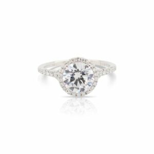 This diamond engagement ring mounting by Sylvie is crafted from 14k white gold and features 0.28 total carats of diamonds along the sides and halo. The center diamond is chosen separately.