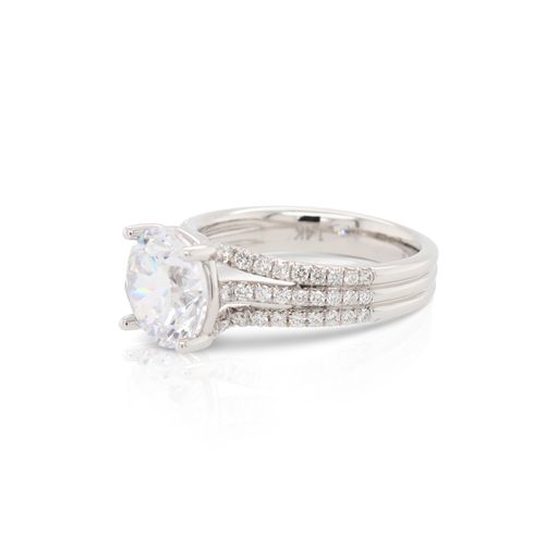 This diamond engagement ring mounting by Sylvie is crafted from 14k white gold and features 0.46 total carats of diamonds along the 3 row shank. The center diamond is chosen separately.