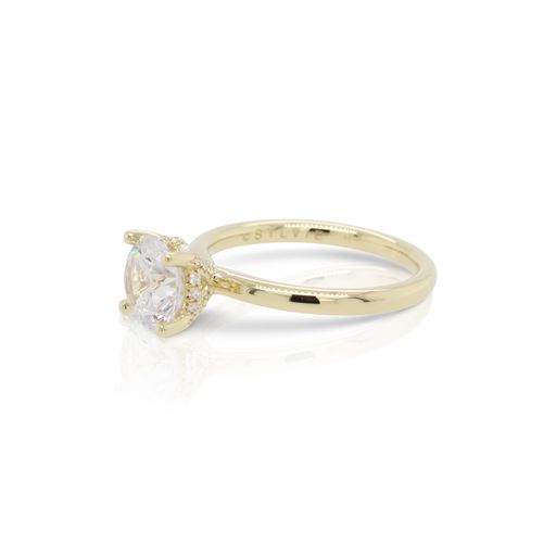 This diamond engagement ring mounting by Sylvie is crafted from 14k yellow gold and features 0.12 total carats of diamonds in the gallery. The center diamond is chosen separately.