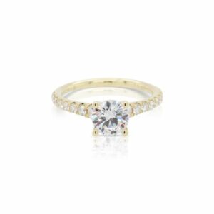 This diamond engagement ring mounting by Sylvie is crafted from 14k yellow gold and features 0.47 total carats of diamonds along the sides. The center diamond is chosen separately.