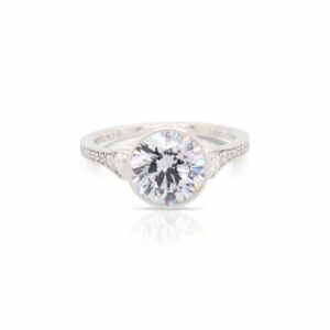 This diamond engagement ring mounting by Sylvie is crafted from 14k white gold and features 0.32 total carats of diamonds along the sides. The center diamond is chosen separately.