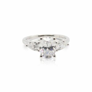 This diamond engagement ring mounting by Sylvie is crafted from 14k white gold and features 0.60 total carats of pear shaped side diamonds. The center diamond is chosen separately.