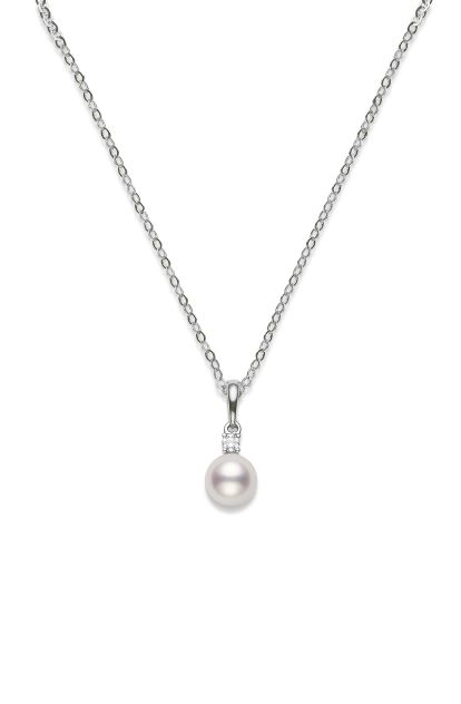 This pearl and diamond pendant from Mikimoto is crafted from 18k white gold and features a 6-6.5mm white pearl and 0.03 carat diamond accent.
