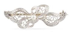 Edwardian styled bow with pearls.