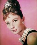 Audrey Hepburn on a pink background.