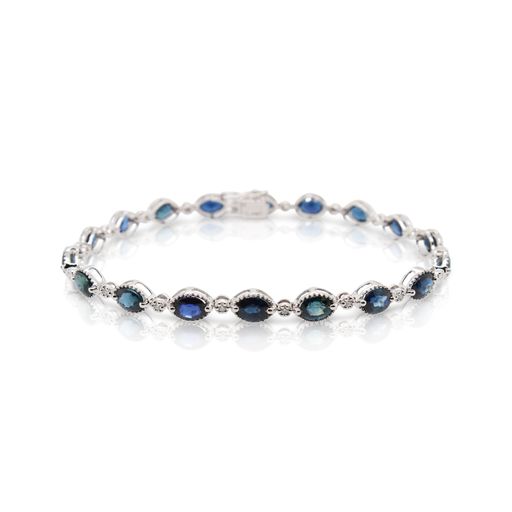 This sapphire and diamond bracelet by Rafael is crafted from 14k white gold and features 9.00 total carats of oval sapphires and 0.13 total carats of diamonds
