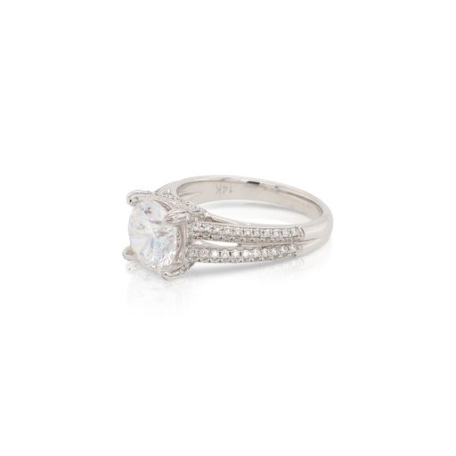 This diamond engagement ring mounting by Sylvie is crafted from 14k white gold and features 0.49 total carats of diamonds along the sides. The center diamond is chosen separately.