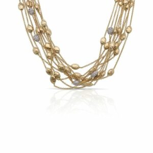 This cluster necklace, part of the Siviglia Collection, by Marco Bicego is crafted from 18k yellow gold and features diamond and gold clusters on each strand.