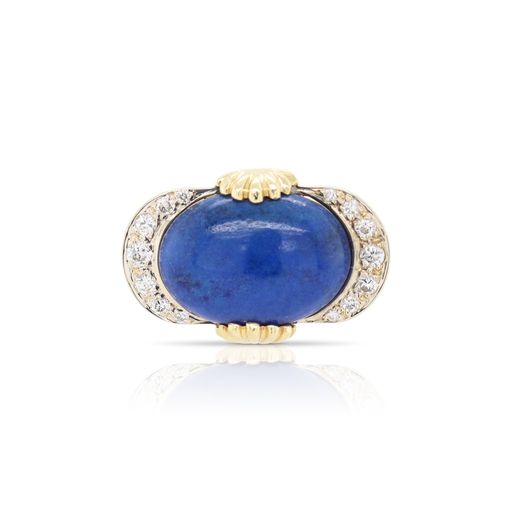 This lapis and diamond ring is crafted from 18k yellow gold and features an oval lapis lazuli and 0.20 total carats of diamonds.