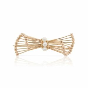 This stylized bow pin is crafted from 14k yellow gold and features 3 pearls.