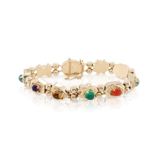 This multicolored bracelet is crafted from 14k yellow gold and features multiple colorful natural stones.