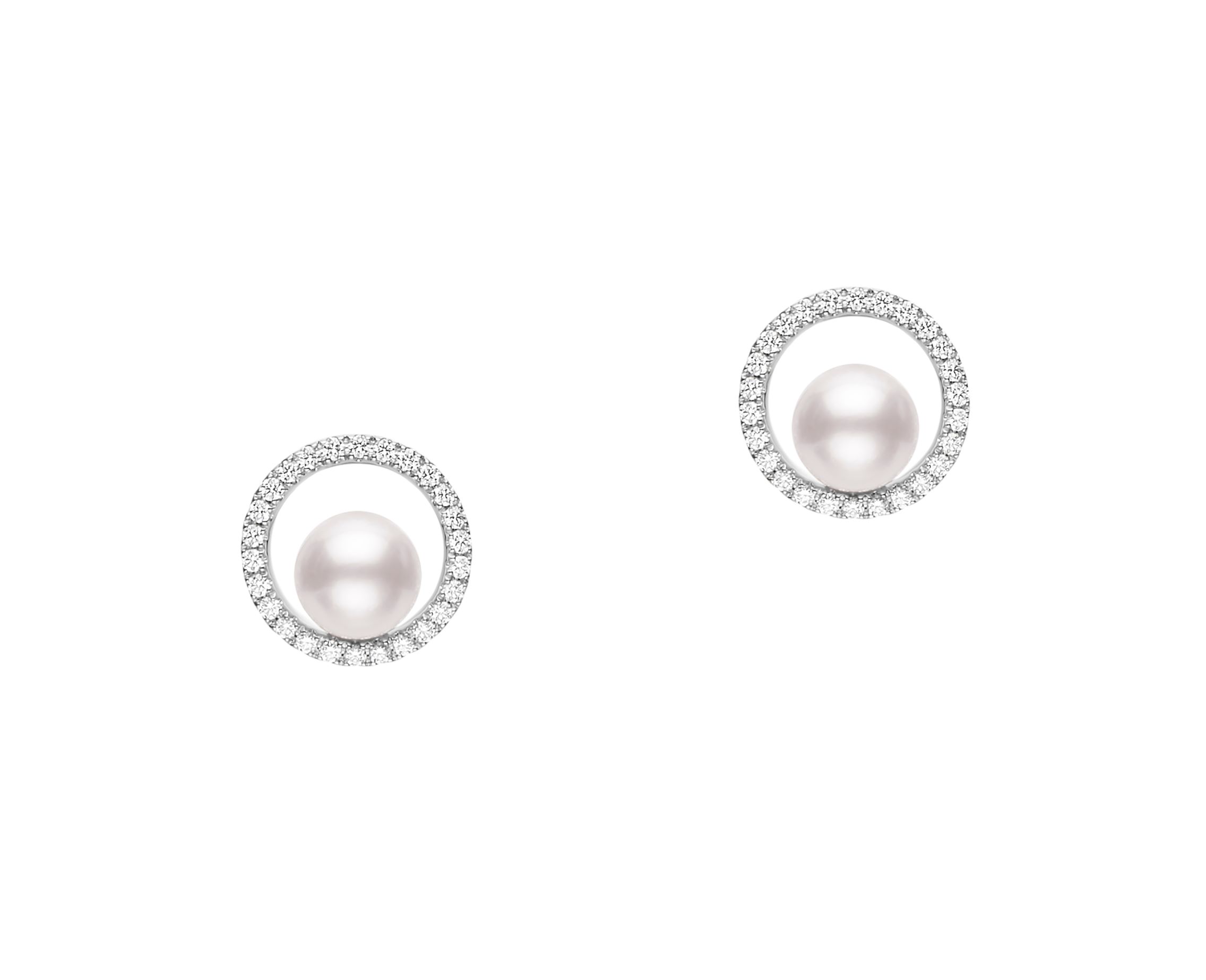 This pair of diamond and pearl earrings by Mikimoto is crafted from 18k white gold and features 6mm white pearls and 0.26 total carats of diamonds around the halo.