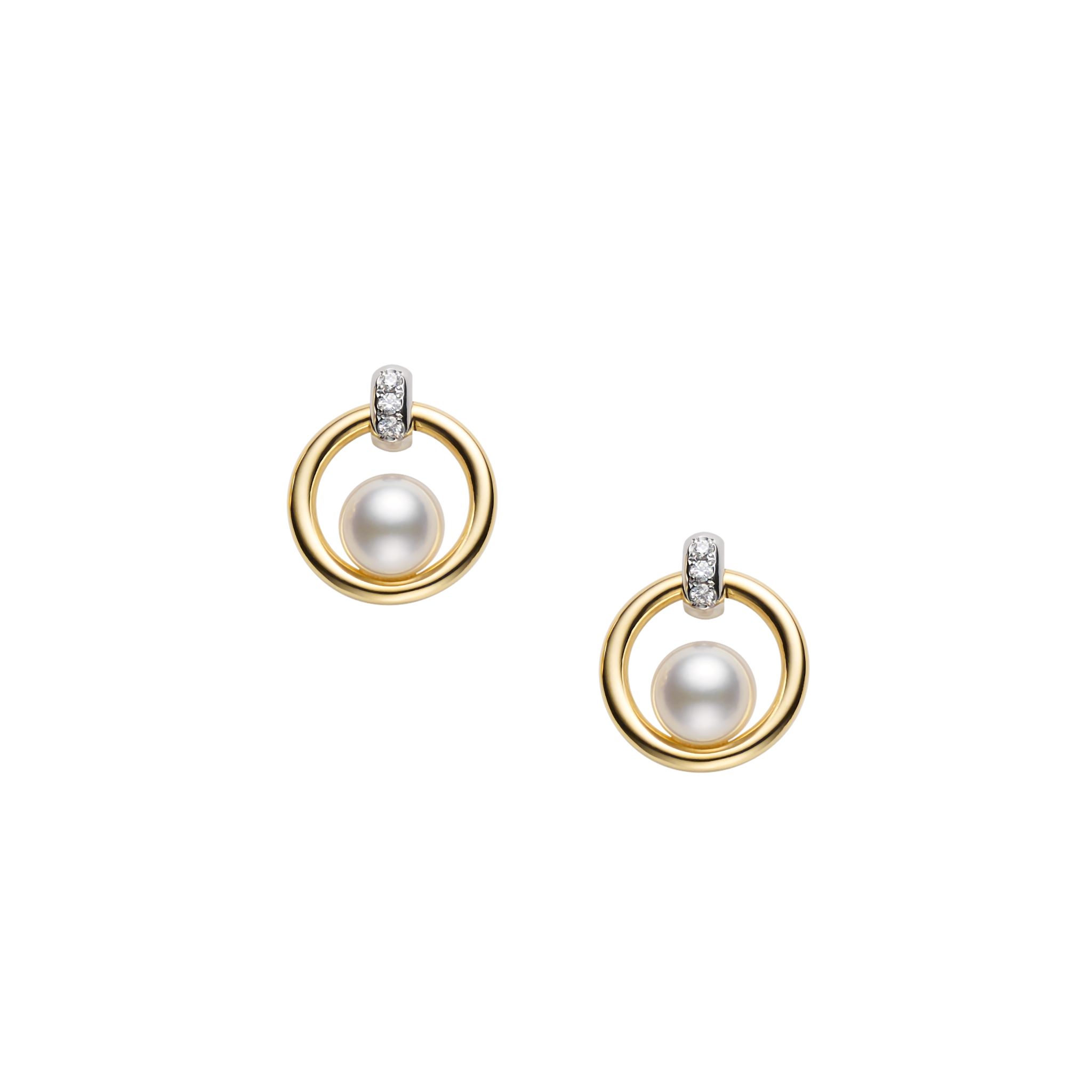 This pair of pearl and diamond cradle earrings by Mikimoto is crafted from 18k yellow gold and features 5.5mm Akoya pearls and 0.02 total carats of diamonds.
