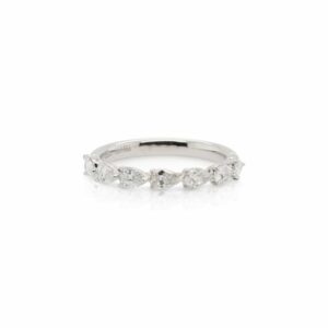 This 7 stone diamond band by Alyssa is crafted from 18k white gold and features 0.70 total carats of pear shaped diamonds.