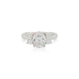 This 3 stone oval diamond engagement ring mounting by Alyssa is crafted from 18k white gold and features 0.66 total carats of side diamonds. The 1.5 carat center diamond is chosen separately.