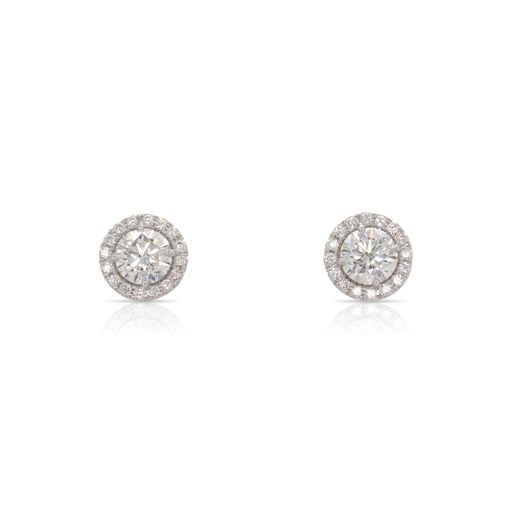 This pair of earrings by Forevermark is crafted from 18k white gold and features 2.03 total carats of round center diamonds and 0.27 total carats of diamonds around the halo.