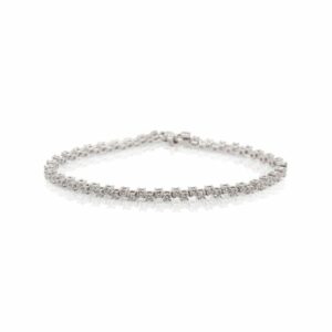 This tennis bracelet is crafted from 18k white gold and features 2.20 total carats of diamonds in a zig zag pattern.