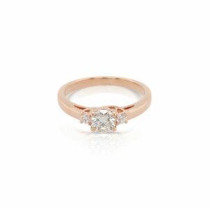 This three stone engagement ring is crafted from 18k yellow gold and features 0.50 total carats of diamonds.