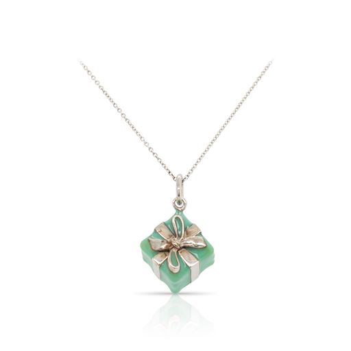 This necklace by Tiffany & Co. is crafted from sterling silver and features a Tiffany blue wrapped gift.