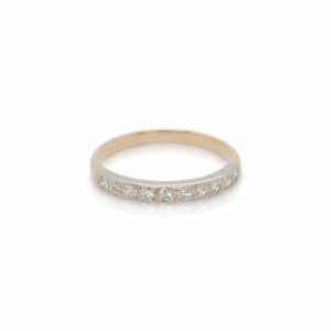 This ring is crafted from 14k white and yellow gold and features 0.20 total carats of diamonds.