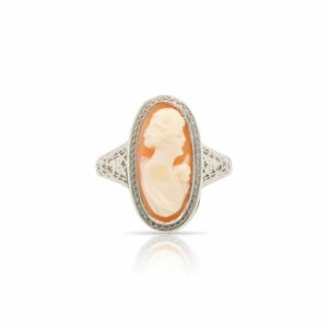 This ring is crafted from 14k white gold and features a shell cameo.