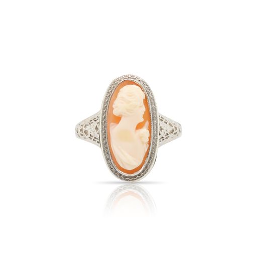 This ring is crafted from 14k white gold and features a shell cameo.