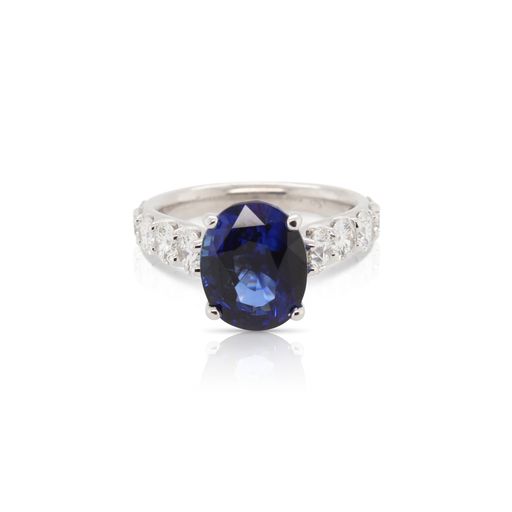 This ring by R.F. Moeller Designs is crafted from 18k white gold and features a 5.18 carat oval sapphire and 1.74 total carats of gradient diamonds along the sides.
