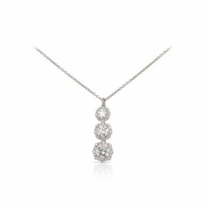 This necklace by Forevermark is crafted from platinum and features 1.09 total carats of gradient diamonds and 0.27 total carats of diamonds around the halos.