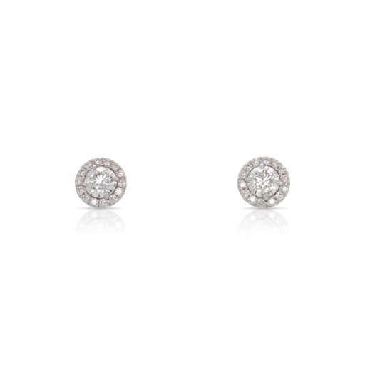 This pair of stud earrings by Forevermark is crafted from 18k white gold and features 1.00 total carats of large round diamonds and 0.05 total carats of diamonds around the halo.