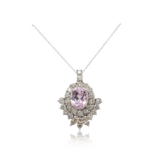 This necklace is crafted from 14k white gold and features a large morganite surrounded by 3.00 total carats of diamonds.